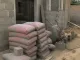 Sacs de ciment reçus sur un chantier résidentiel